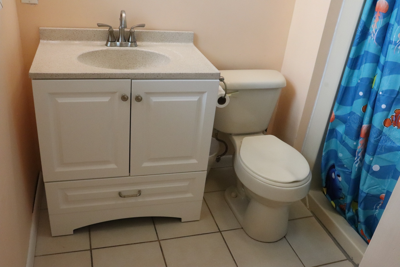 Your private bathroom features a vanity with storage, sink, toilet, and shower—everything you need for a comfortable stay.