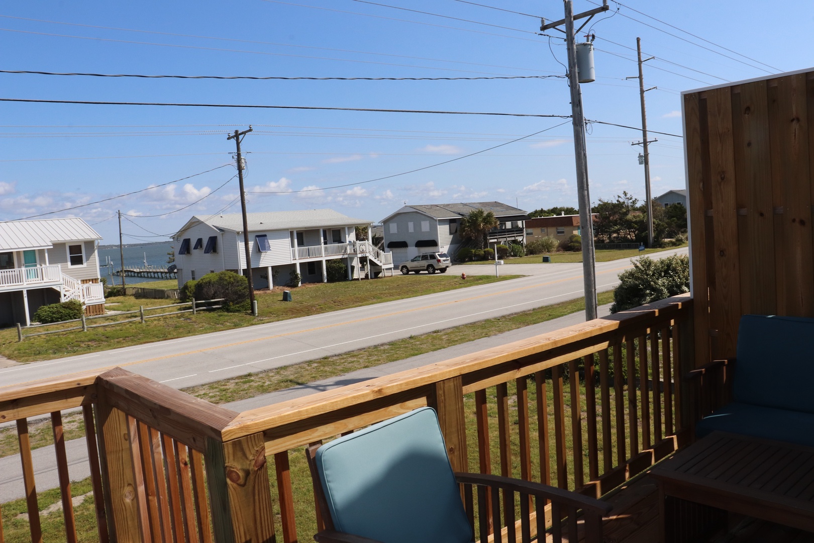Coastal neighborhood with beach houses and ocean views from elevated vantage point.