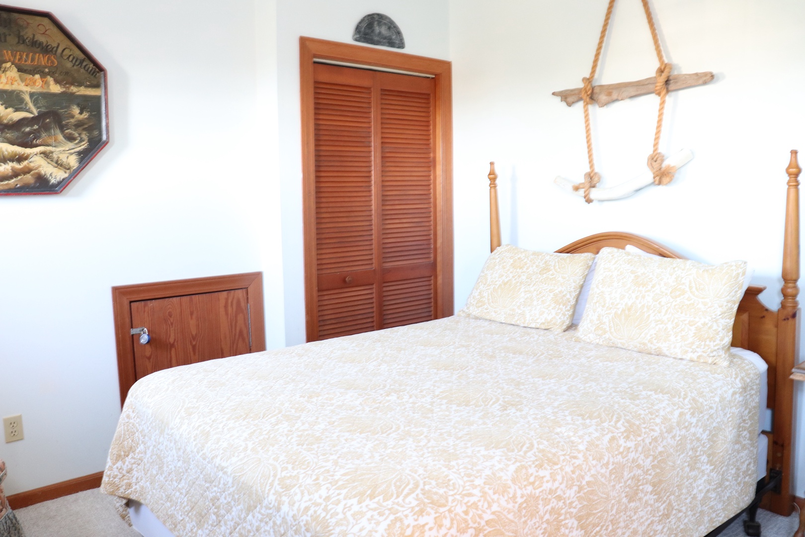 Drift off in your cozy nautical bedroom with crisp white linens and charming maritime touches that create the perfect seaside retreat.