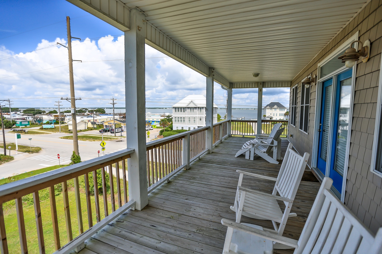 Relax in your private rocking chairs while watching the coastal community come to life below.