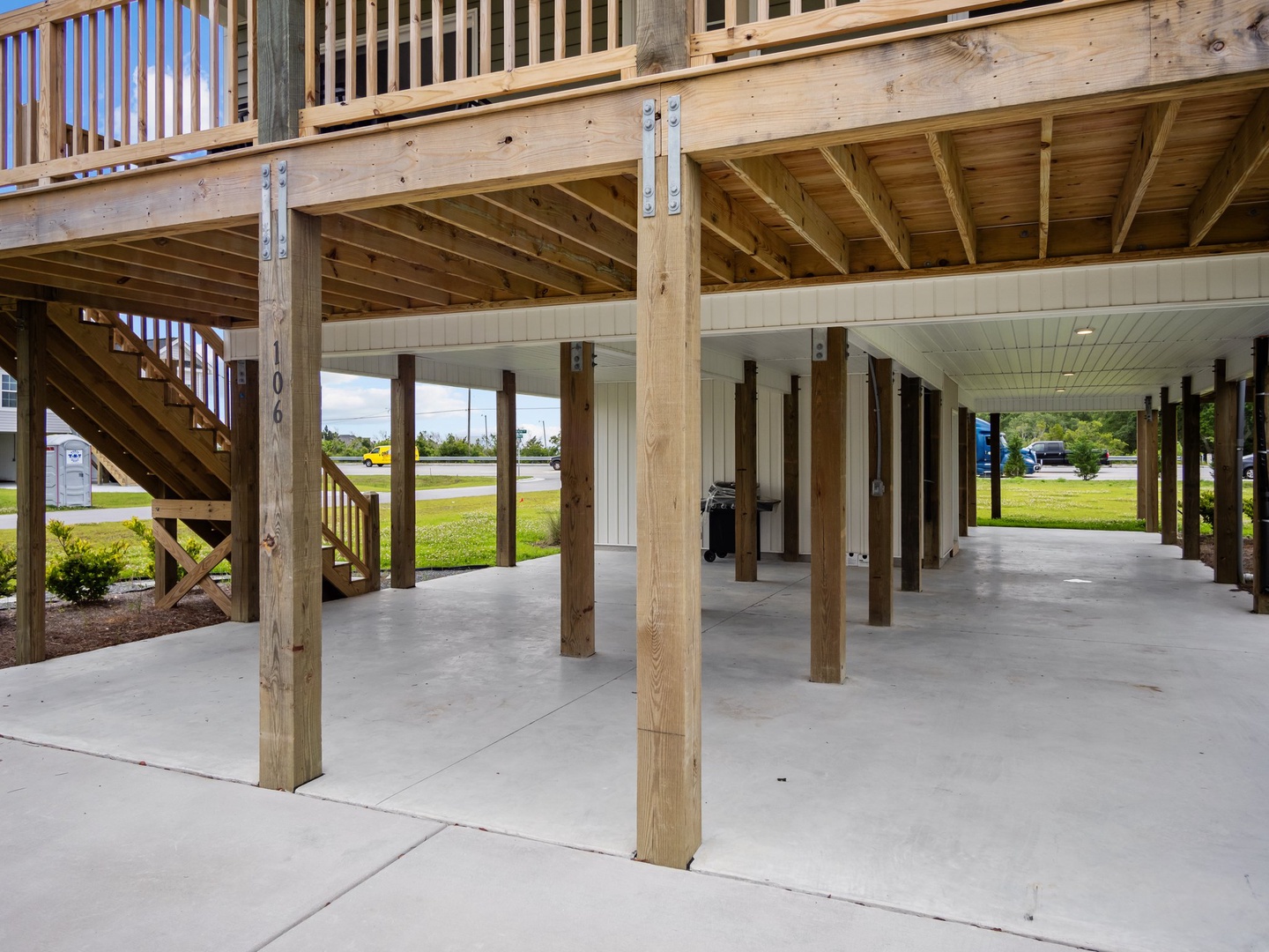 Spacious covered parking area beneath the property offers protection from the elements with easy access to your vacation home.