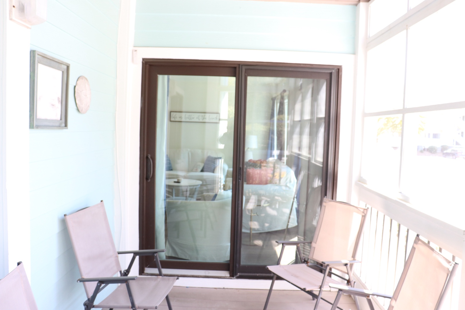 Your private balcony features comfortable seating with French doors opening to your bright, airy suite.
