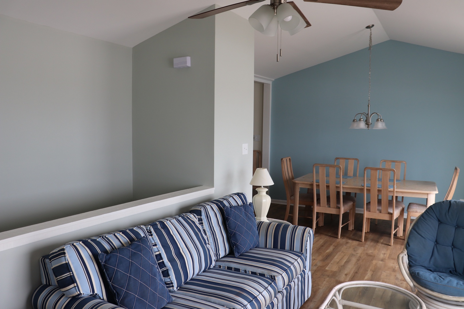 Relax in your open-concept living space where nautical stripes meet coastal colors, complete with dining for six.