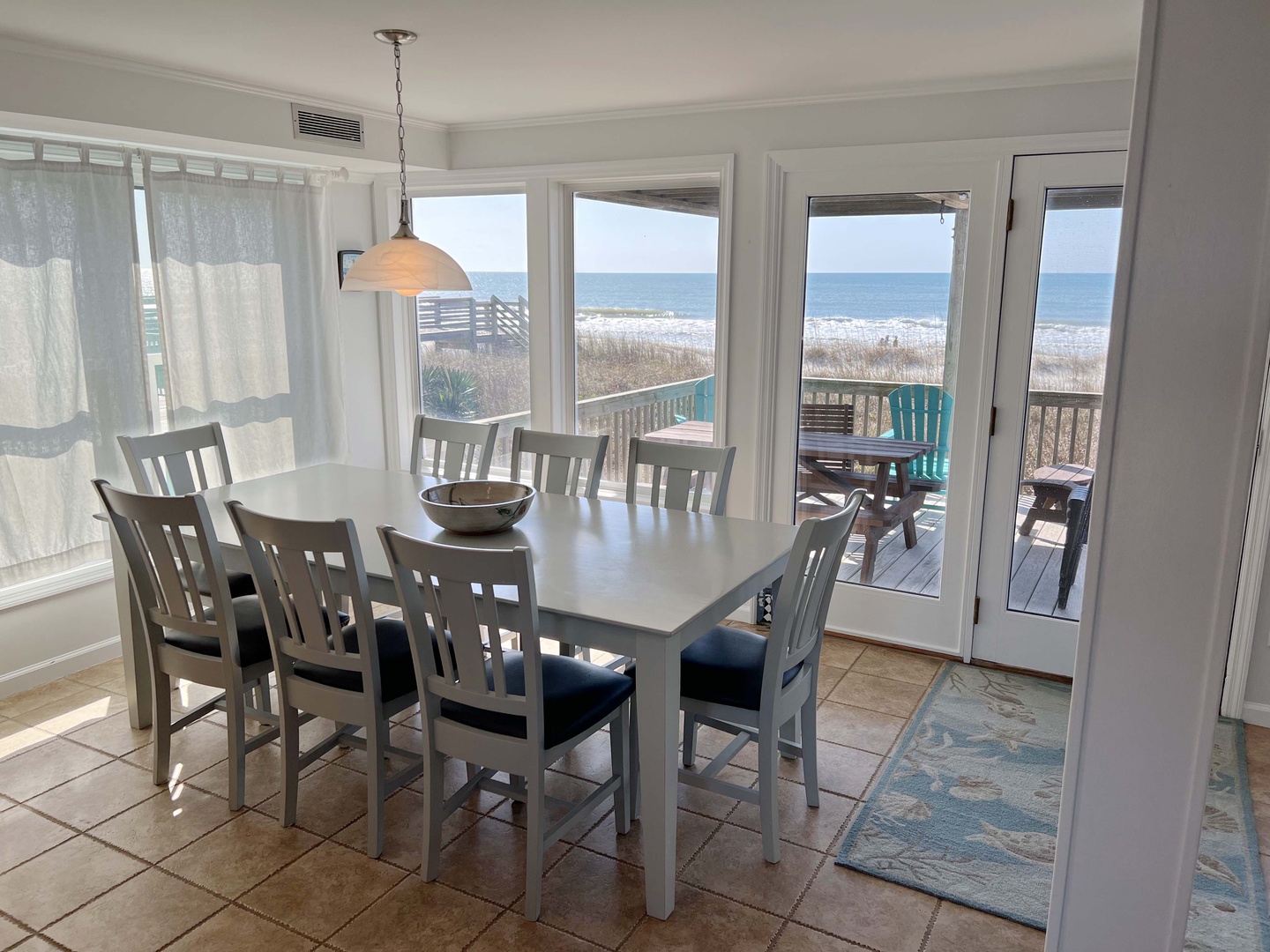 Gather for memorable meals at your spacious dining table while waves crash just beyond your private deck and ocean views.