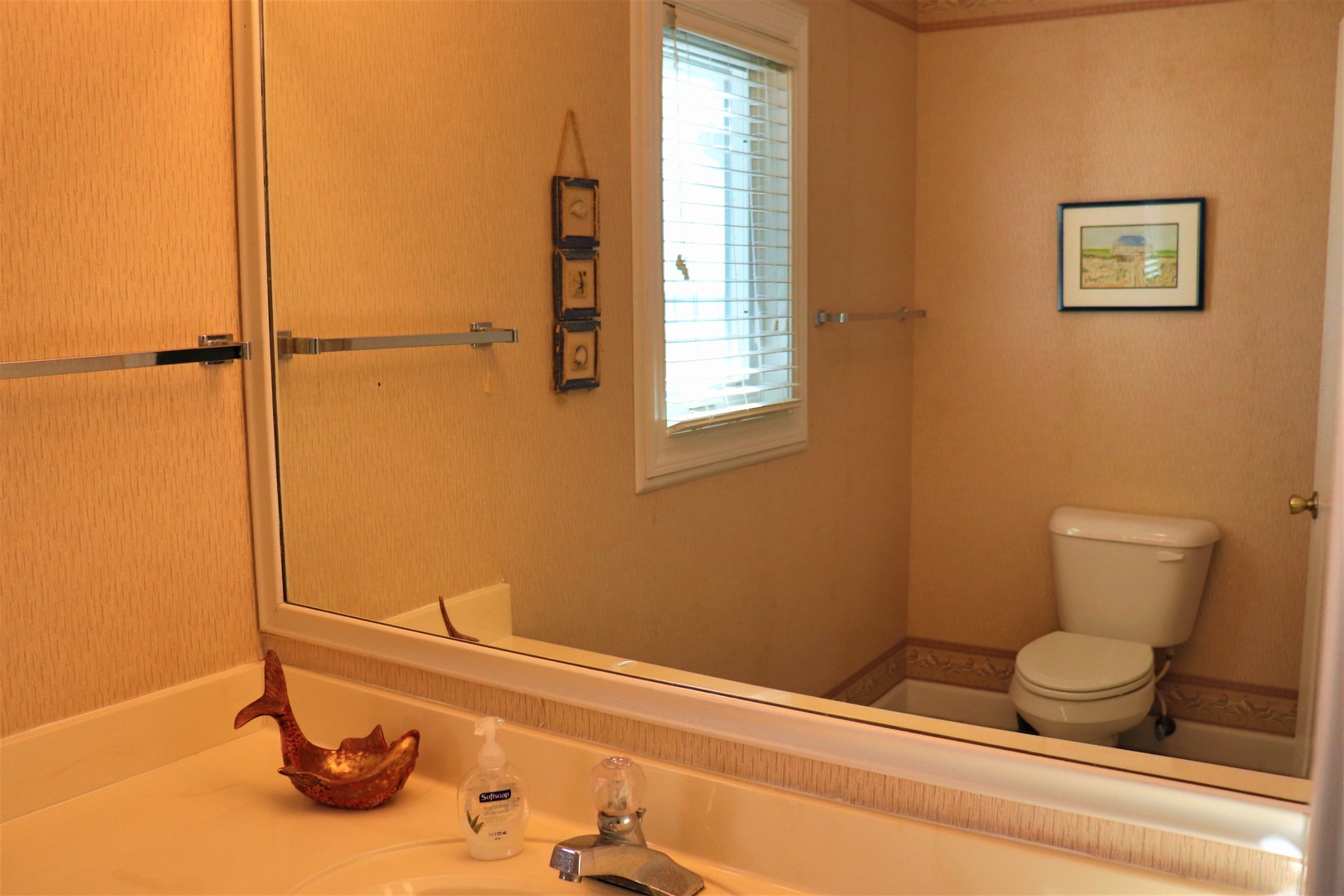 Your private bathroom offers a peaceful retreat with warm lighting, modern fixtures, and thoughtful touches to make your stay comfortable.