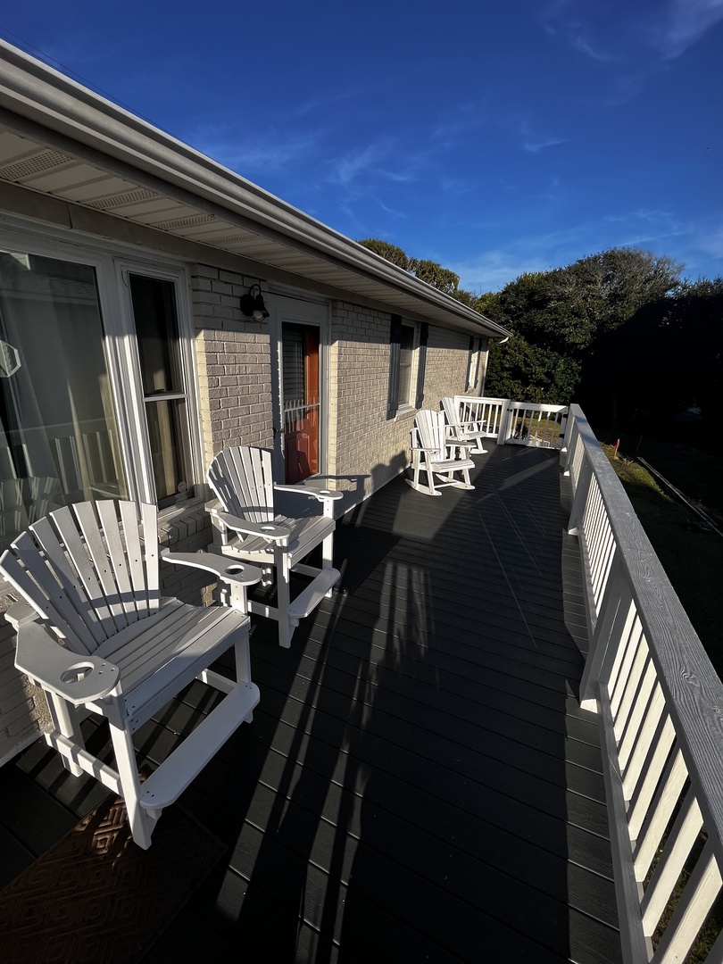 Charming property exterior with traditional architecture and natural surroundings under clear blue skies.