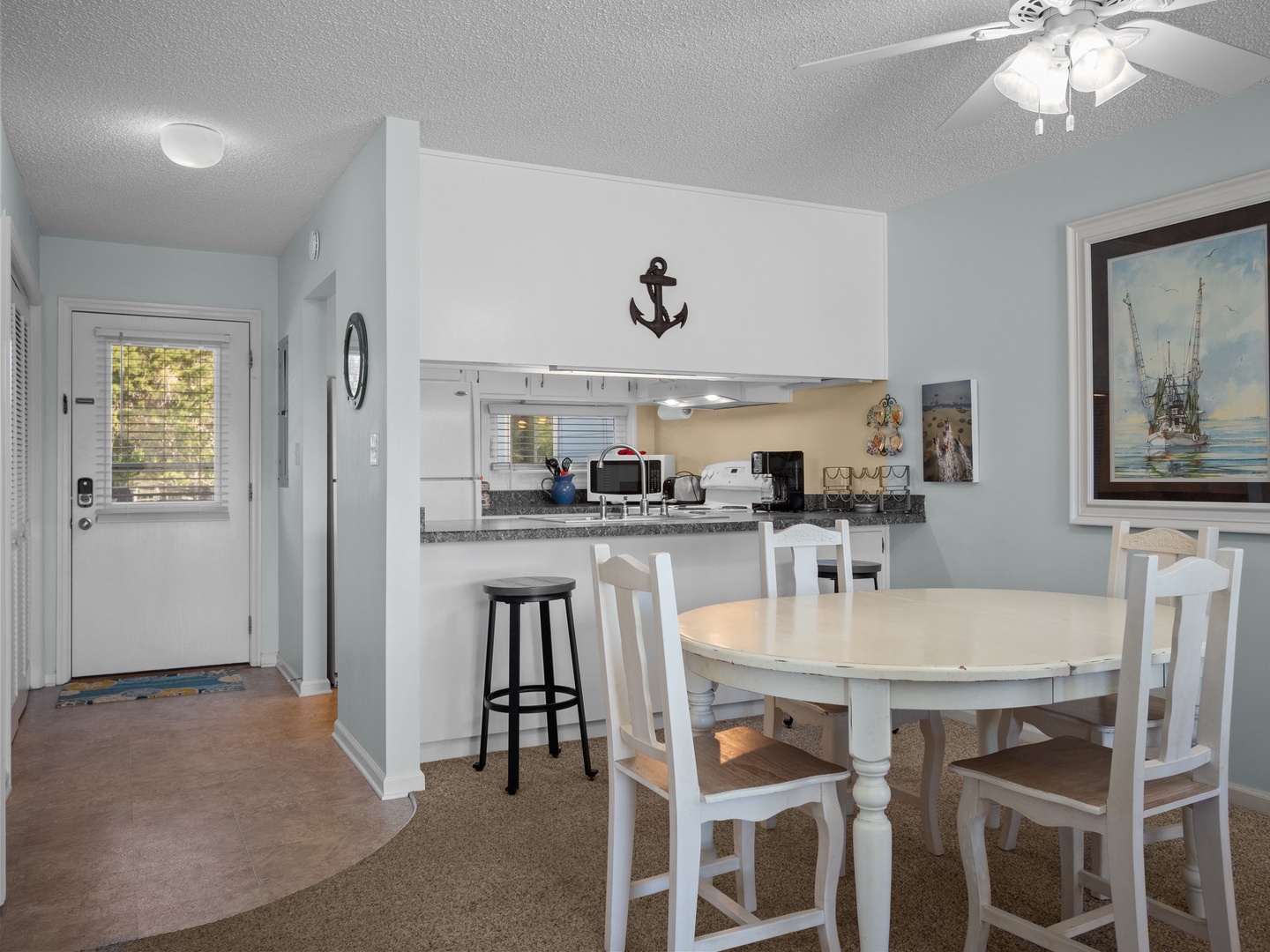 Gather around your coastal dining table where nautical charm meets modern comfort, perfect for sharing meals and making memories.