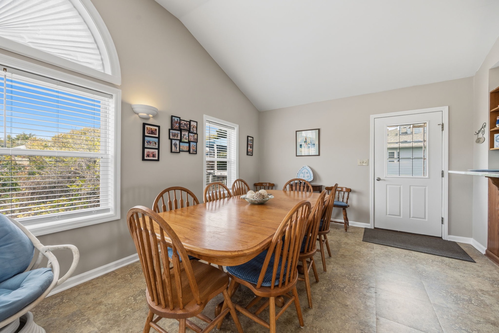 Gather around the spacious dining table where your group can share meals and create memories together in this bright, welcoming space.