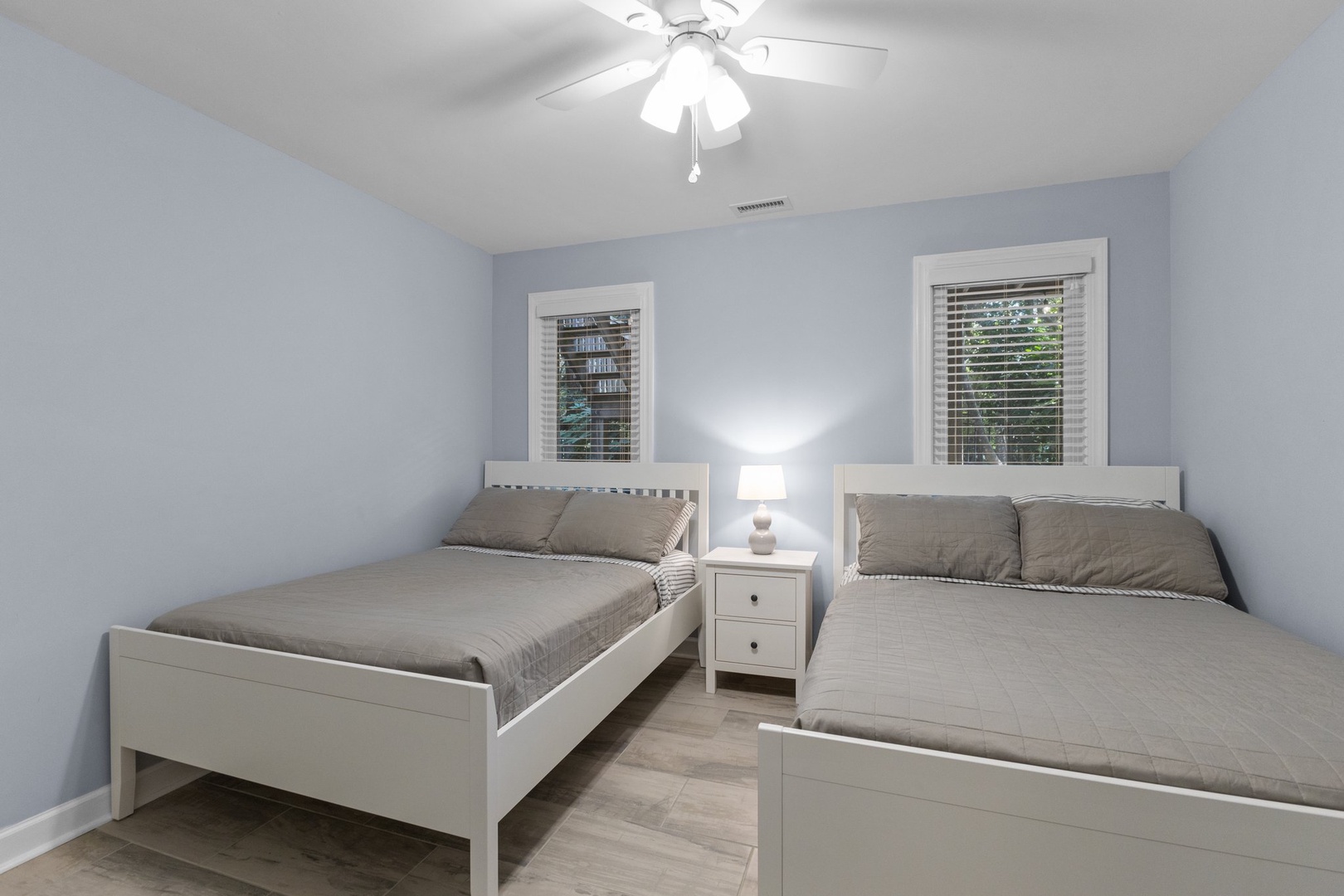 Drift off to sleep in your peaceful twin bedroom, complete with soft linens and gentle ceiling fan to keep you comfortable all night.