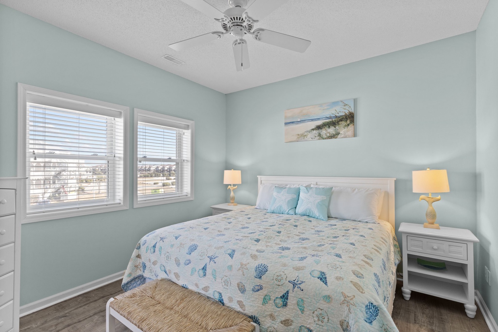 Drift off to sleep in your peaceful coastal bedroom with soothing sea-glass walls and ocean-themed linens that whisper of seaside dreams.