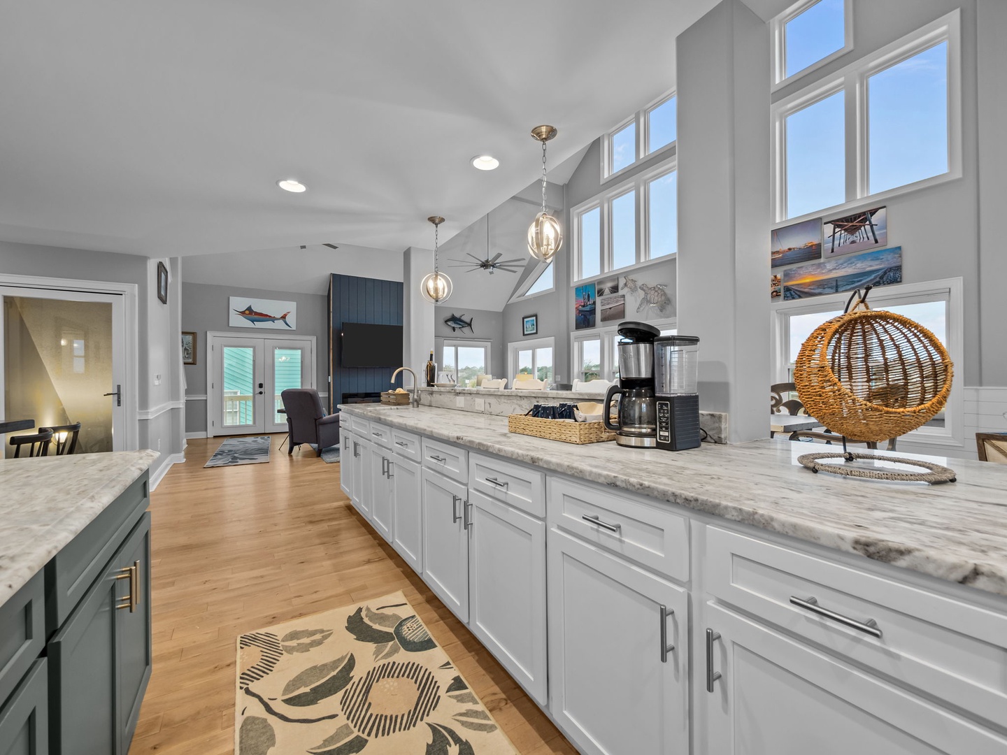 Your gourmet kitchen awaits with marble counters, premium appliances, and soaring ceilings flooded with natural light for memorable meal prep.
