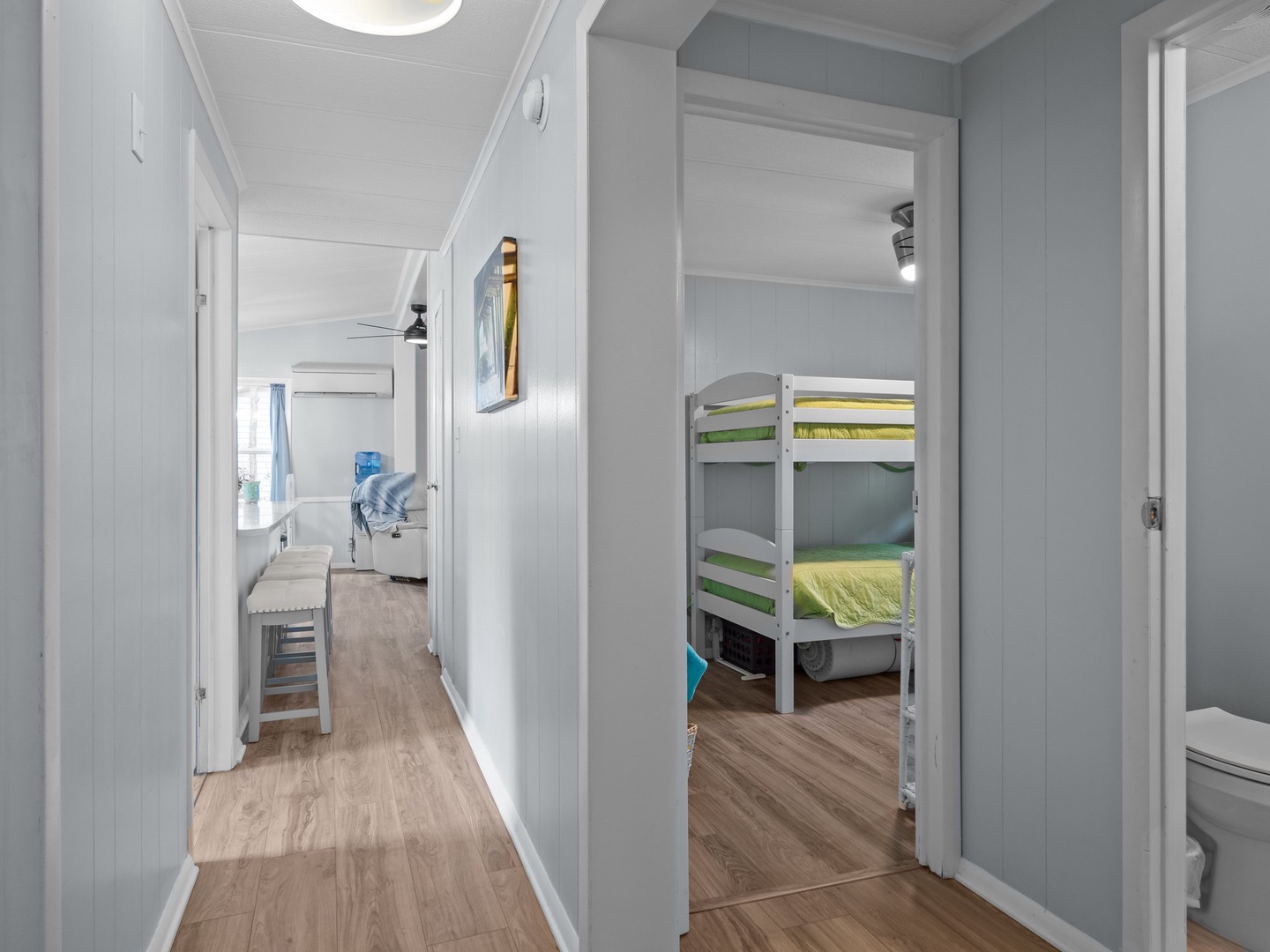 Your cozy bunk room offers comfortable sleeping for the kids, perfectly positioned near the bathroom for convenience.