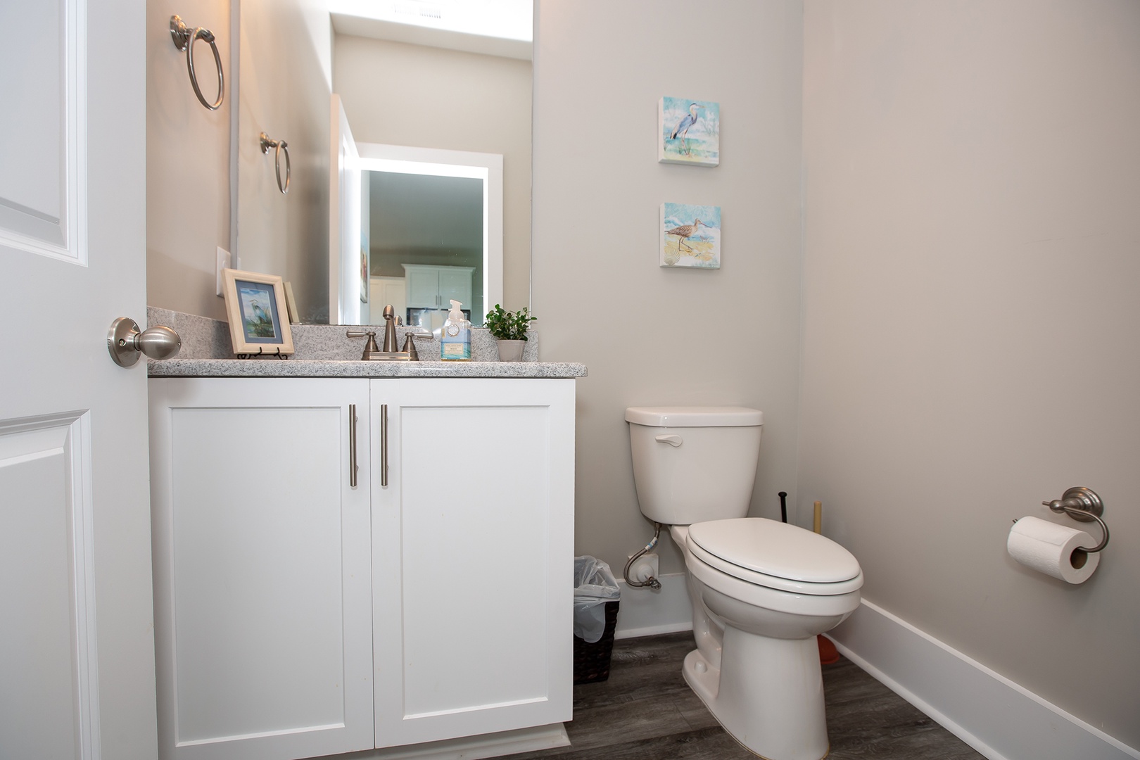 Refresh in your bright, clean powder room with modern fixtures and thoughtful coastal touches that make daily routines feel like spa moments.