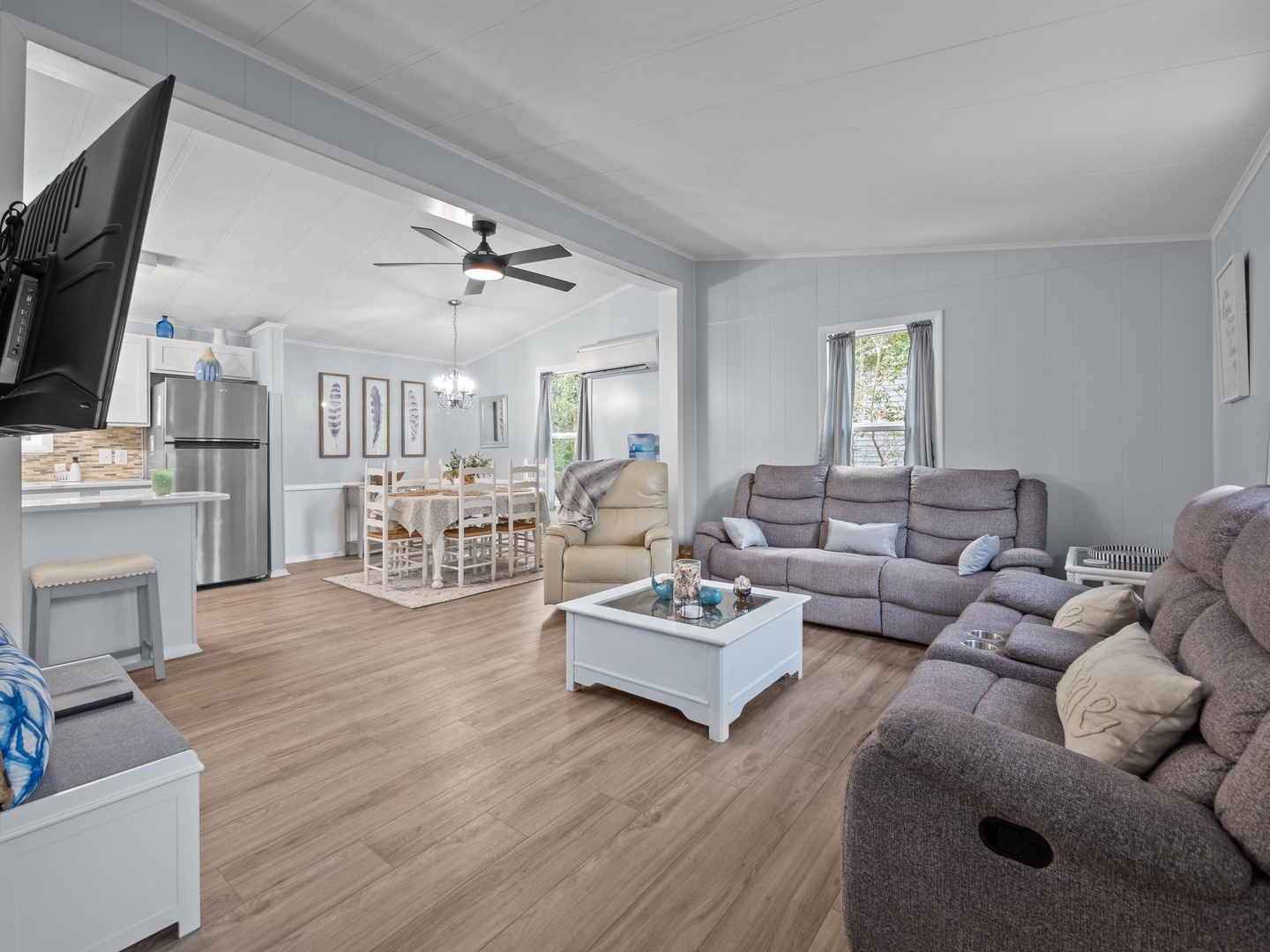 Relax in your spacious open-plan living area with plush sectional seating and modern kitchen—perfect for gathering after adventures.