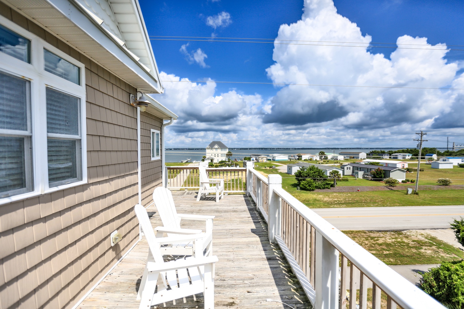 Relax in your private rocking chairs while soaking up stunning coastal views from this expansive deck.
