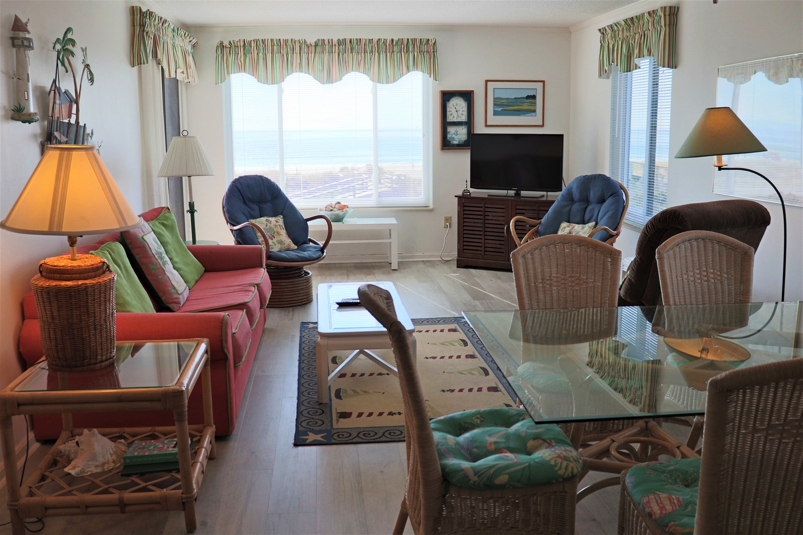 Unwind in your bright, welcoming living space with comfortable seating, warm lighting, and tropical touches that create the perfect beach getaway atmosphere.