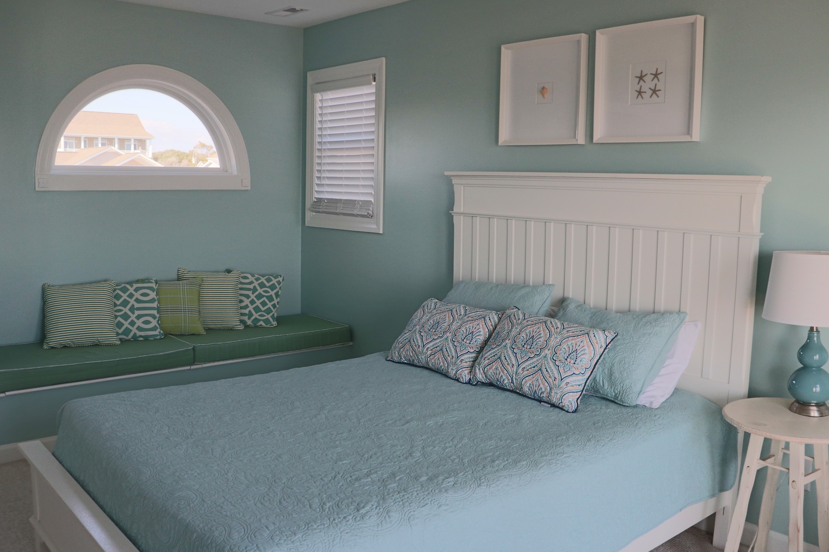 Wake up in your serene coastal bedroom where soothing sea-glass walls and crisp white linens create the perfect seaside sanctuary for restful nights.
