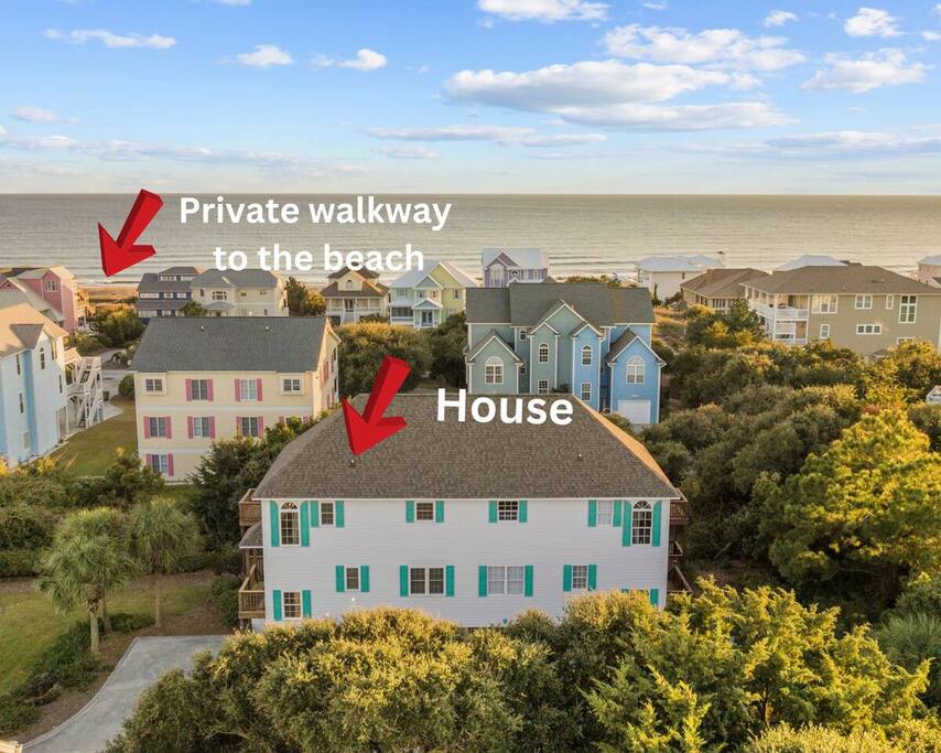 Coastal retreat with private beach walkway just steps from the ocean, nestled among charming beach homes.