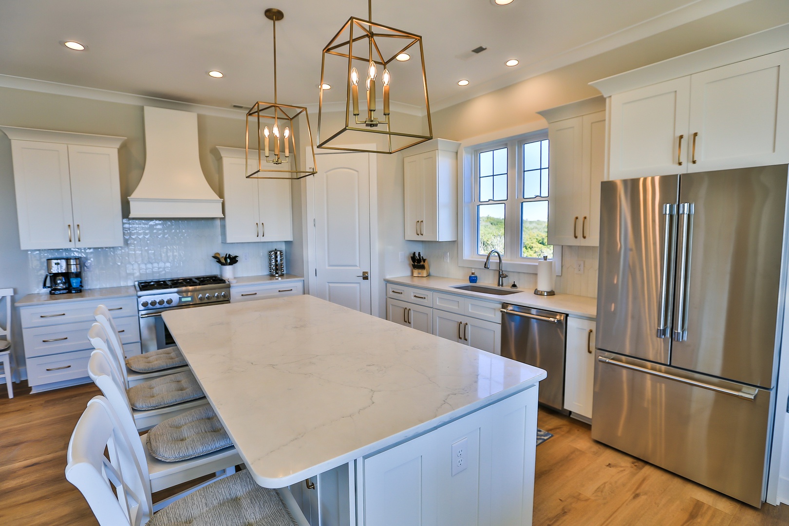 Your gourmet kitchen awaits with marble countertops, stainless steel appliances, and a spacious island perfect for cooking memorable meals together.