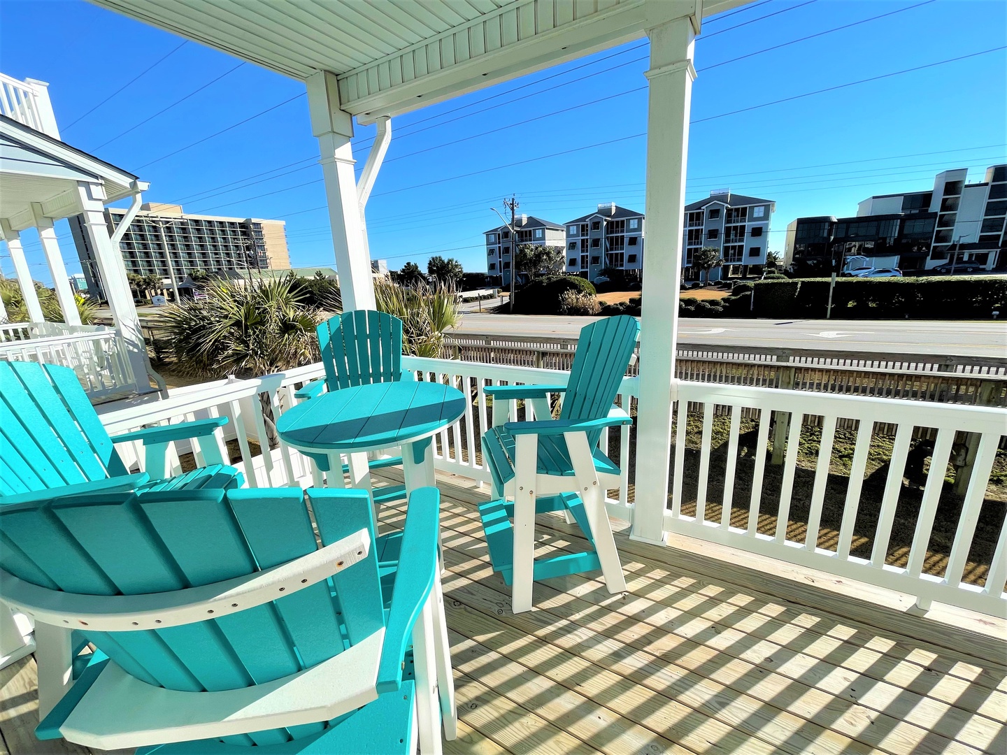 Sink into these bright turquoise Adirondack chairs on your covered deck, where morning coffee tastes better with ocean breezes and coastal views.