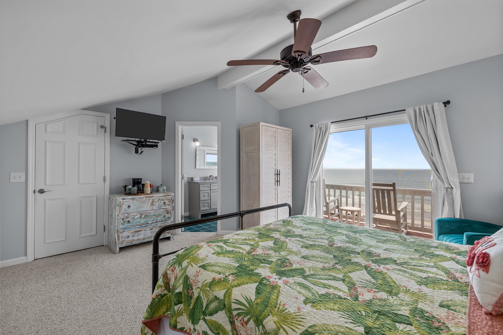 Wake up to ocean views from your comfortable bedroom, complete with ceiling fan and private balcony access for morning coffee.
