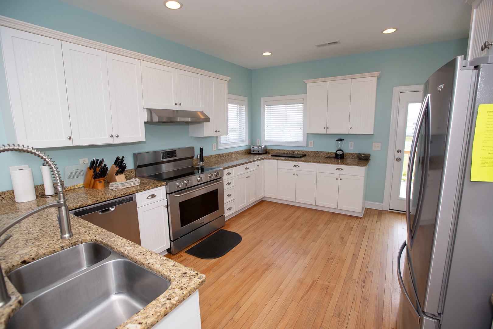 Your spacious kitchen features granite countertops, stainless steel appliances, and plenty of cabinet space for all your culinary adventures.