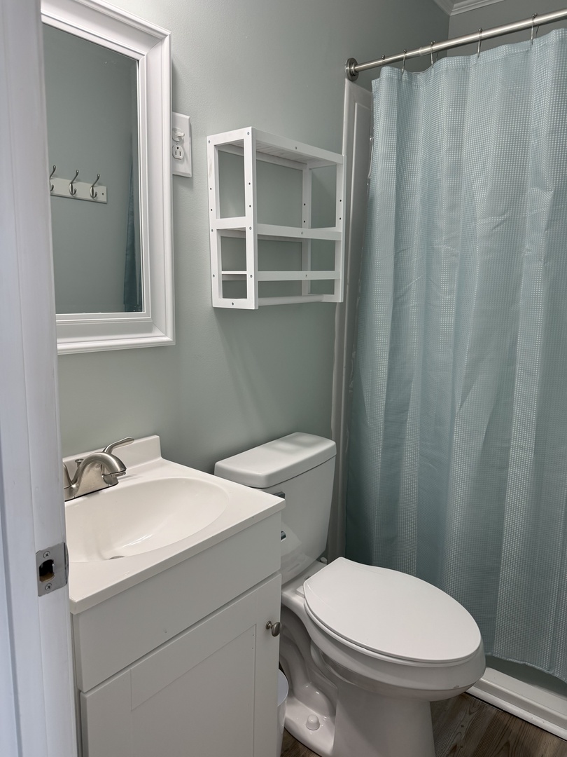 Your private bathroom features fresh soothing colors, convenient storage, and everything you need for a comfortable stay.