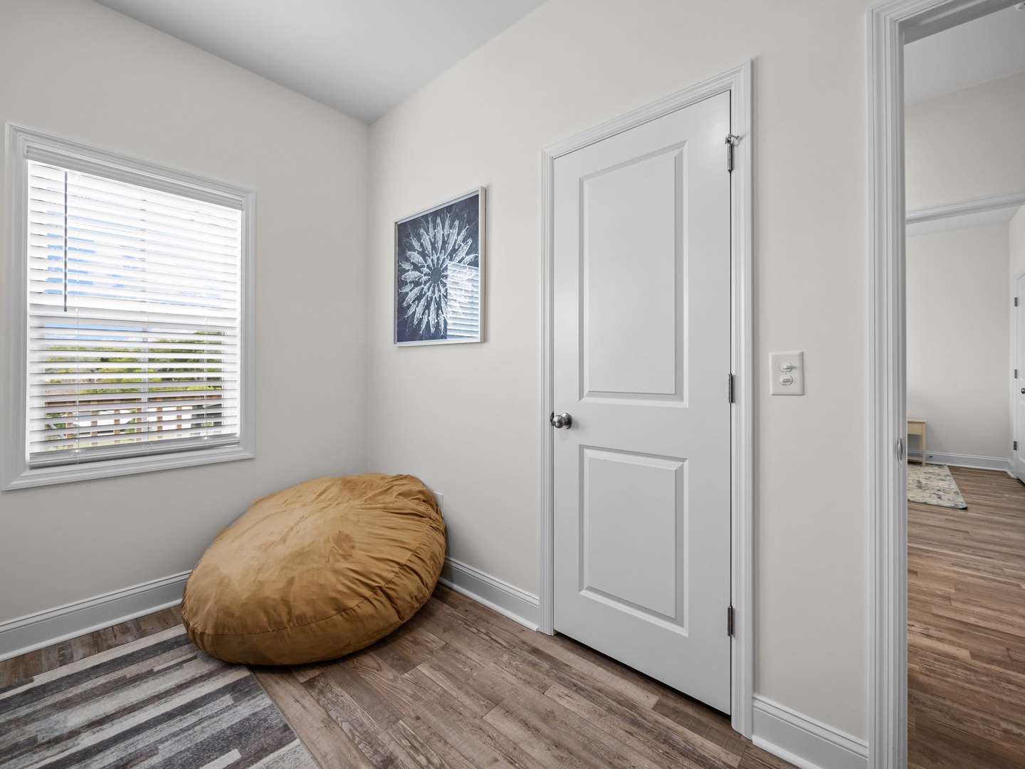 Sink into your oversized bean bag by the window, where natural light streams in and creates the perfect reading nook for lazy afternoons.