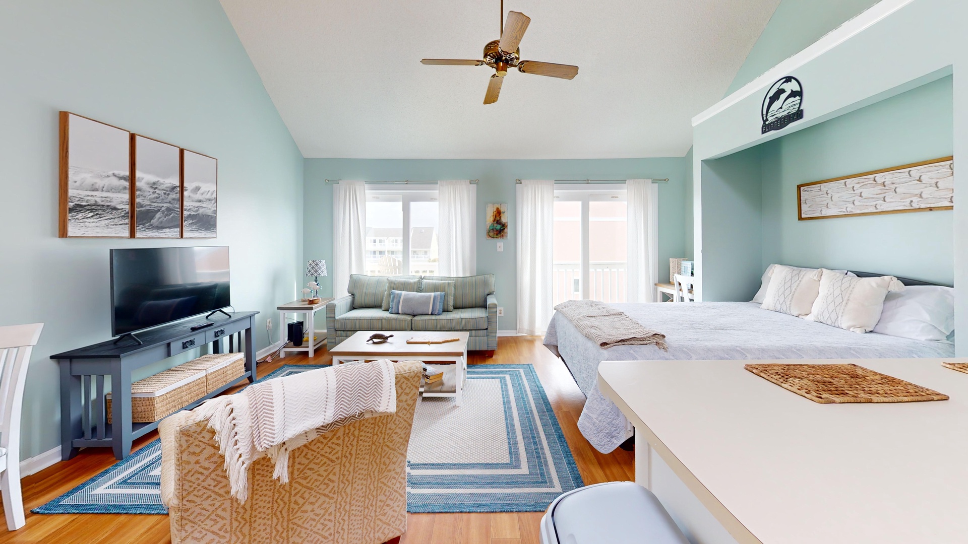 Your spacious retreat combines bedroom comfort with living room relaxation, featuring soothing coastal colors and plenty of natural light.