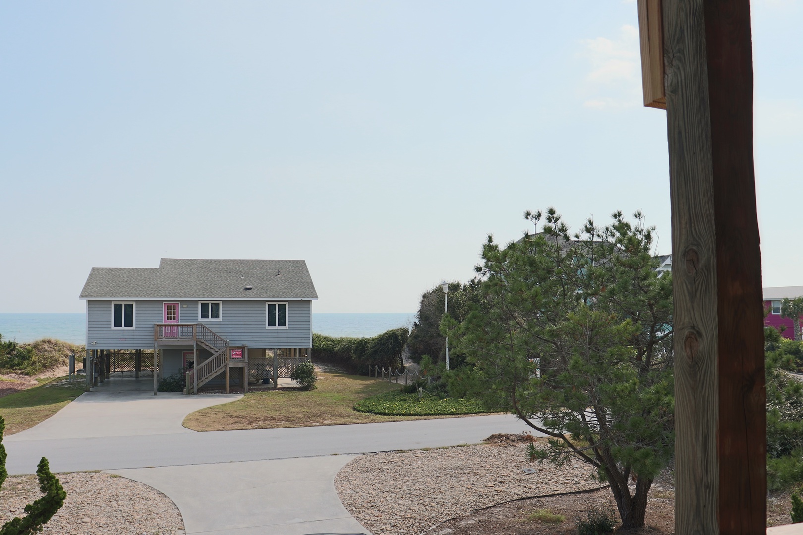 Coastal neighborhood with beach houses and ocean views, offering a peaceful seaside setting for your getaway.