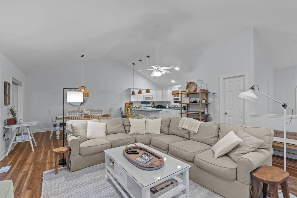 Sink into plush sectional seating where you can unwind after exploring, with open kitchen and dining spaces perfect for gathering.