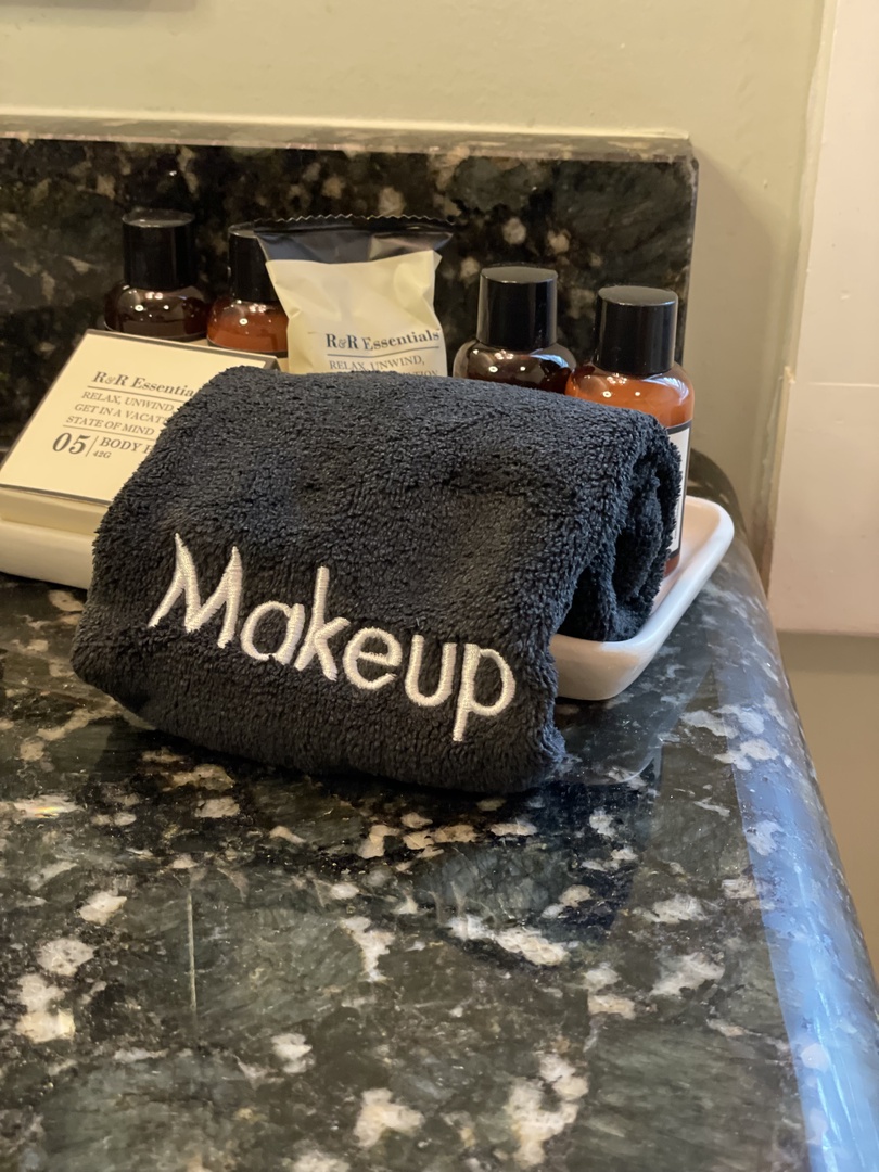 Unwind in your private bathroom with personalized touches, including makeup towels and quality amenities thoughtfully arranged for your comfort.