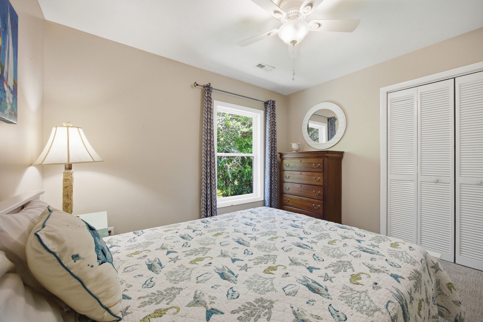 Drift off to sleep in this cozy bedroom with soft linens, natural light, and thoughtful touches.