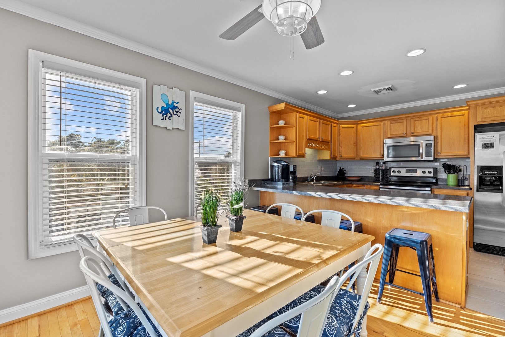 Sunlight streams through your kitchen windows, creating perfect spots for morning coffee and meal prep in this bright, open space.