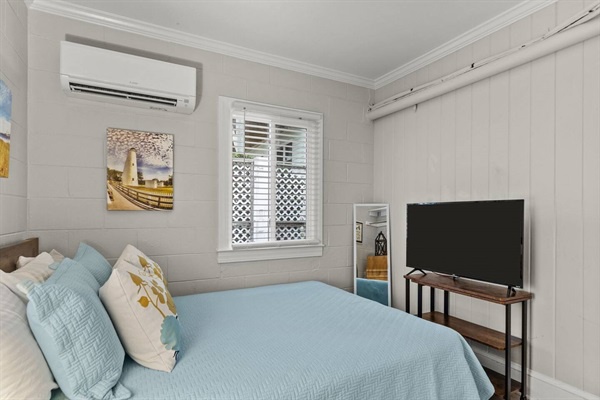 Your peaceful bedroom retreat features cozy bedding, modern entertainment, and climate control for perfect comfort throughout your stay.