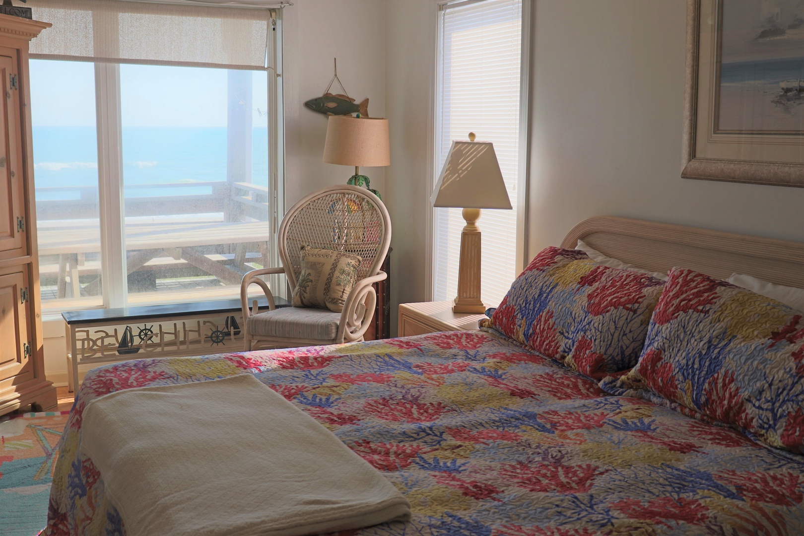 Wake up to stunning ocean views from your cozy bedroom, where coastal decor meets comfort in this peaceful seaside retreat.