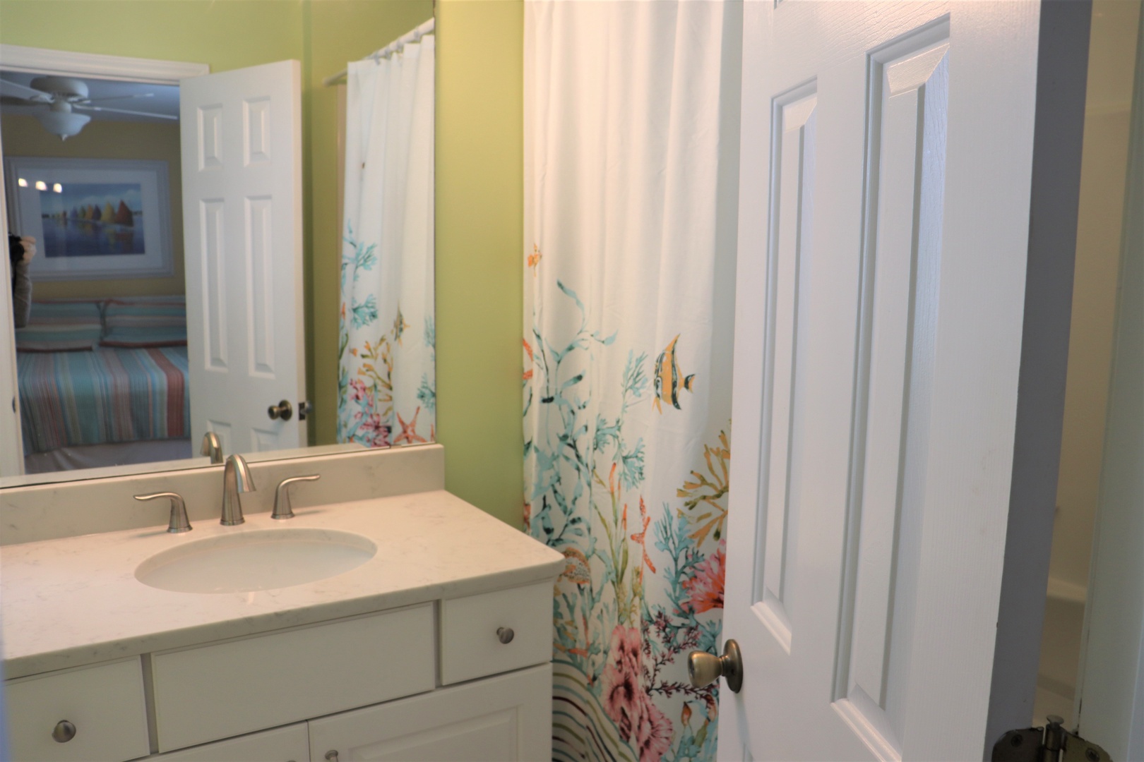 Step into your bright, cheerful bathroom with playful underwater-themed curtains that'll transport you to an ocean paradise.