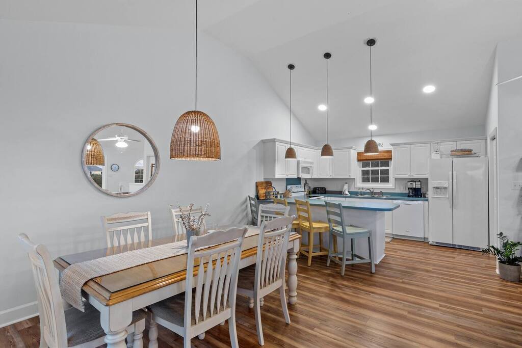 Gather around your bright, open dining and kitchen space featuring warm wood floors, stylish pendant lighting, and everything you need to create memorable meals together.