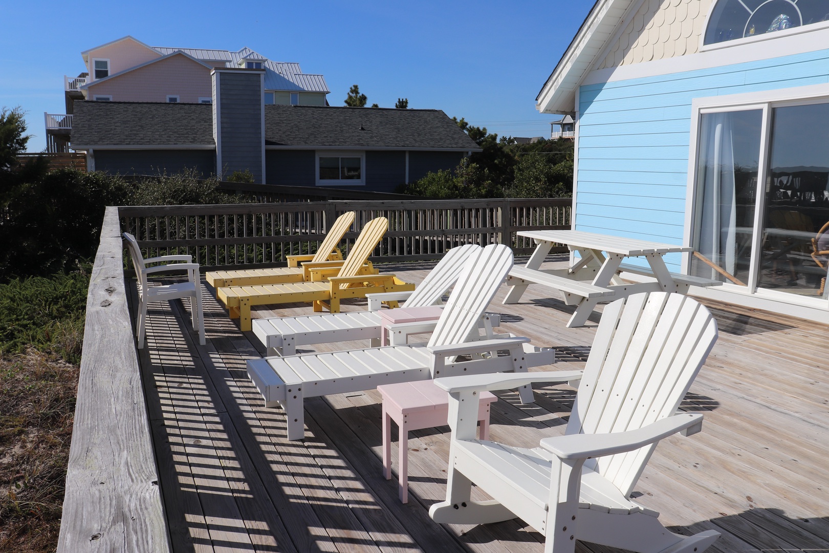 Stretch out on your private deck with comfortable Adirondack chairs, perfect for morning coffee or evening relaxation with neighborhood views.