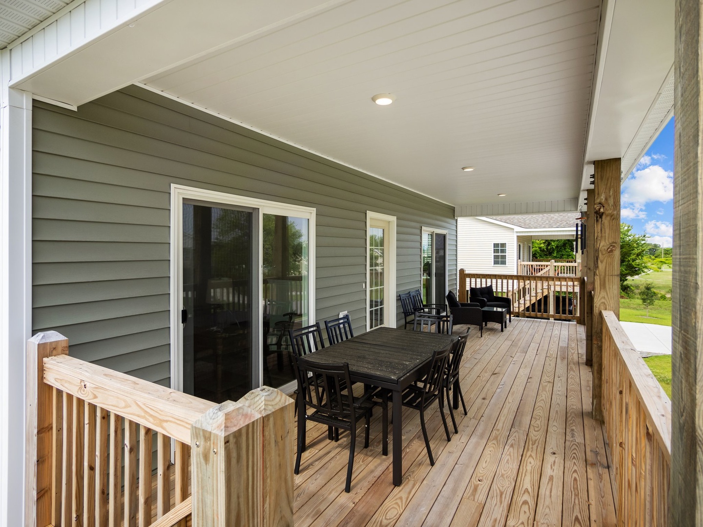 Gather around your private covered deck for meals with stunning countryside views stretching beyond the wooden railings.