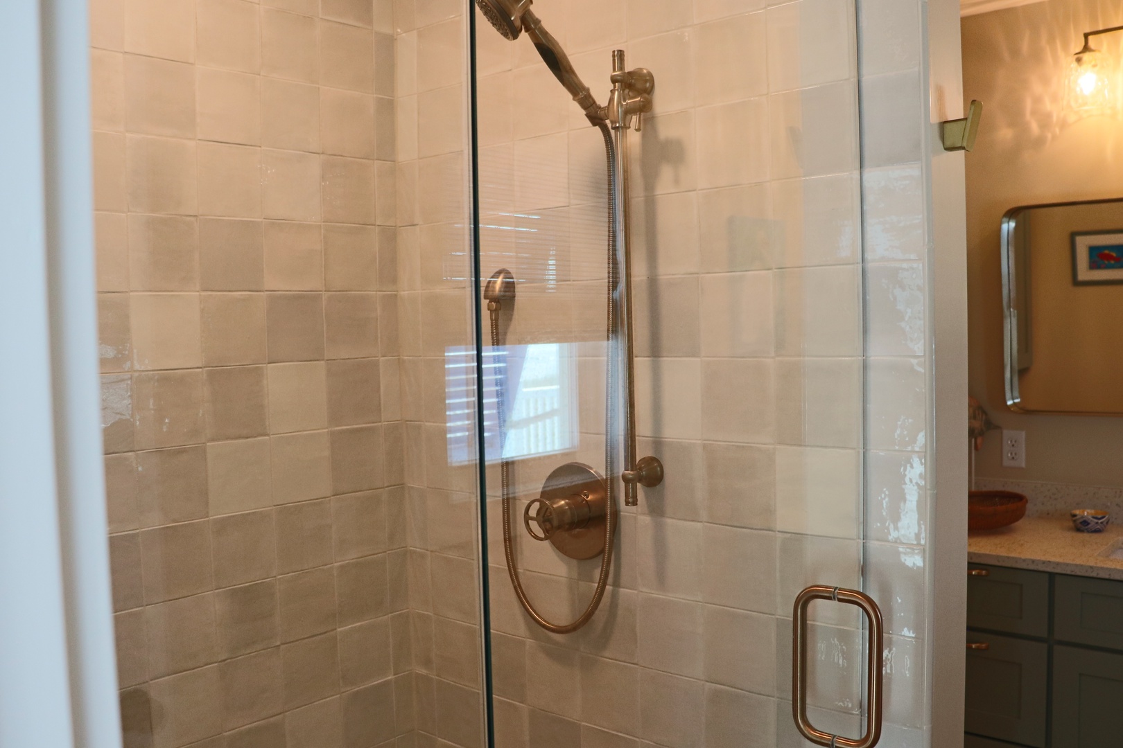 Step into your elegant glass-enclosed shower with premium fixtures and warm tile - your perfect retreat after exploring.