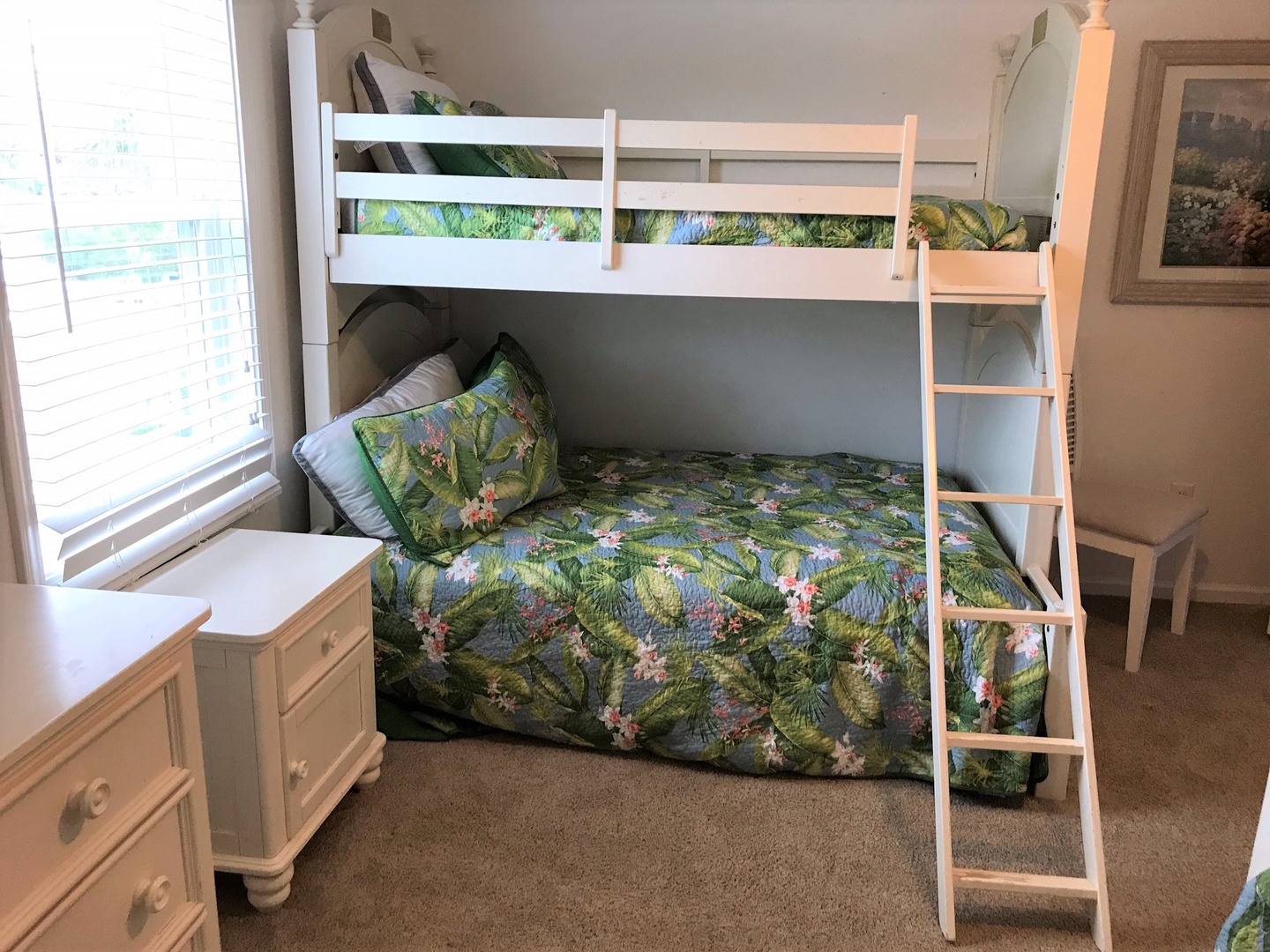 Your kids will love this cheerful bunk bed room with tropical-themed bedding and plenty of space to play and store their belongings.