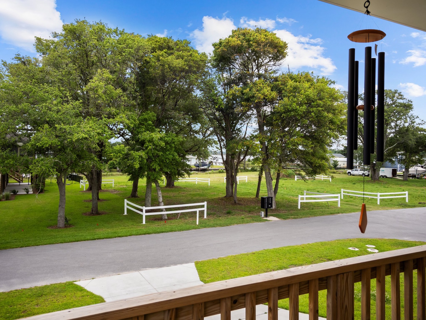 Peaceful parkland with mature trees and walking paths visible from the property, offering a tranquil neighborhood setting.