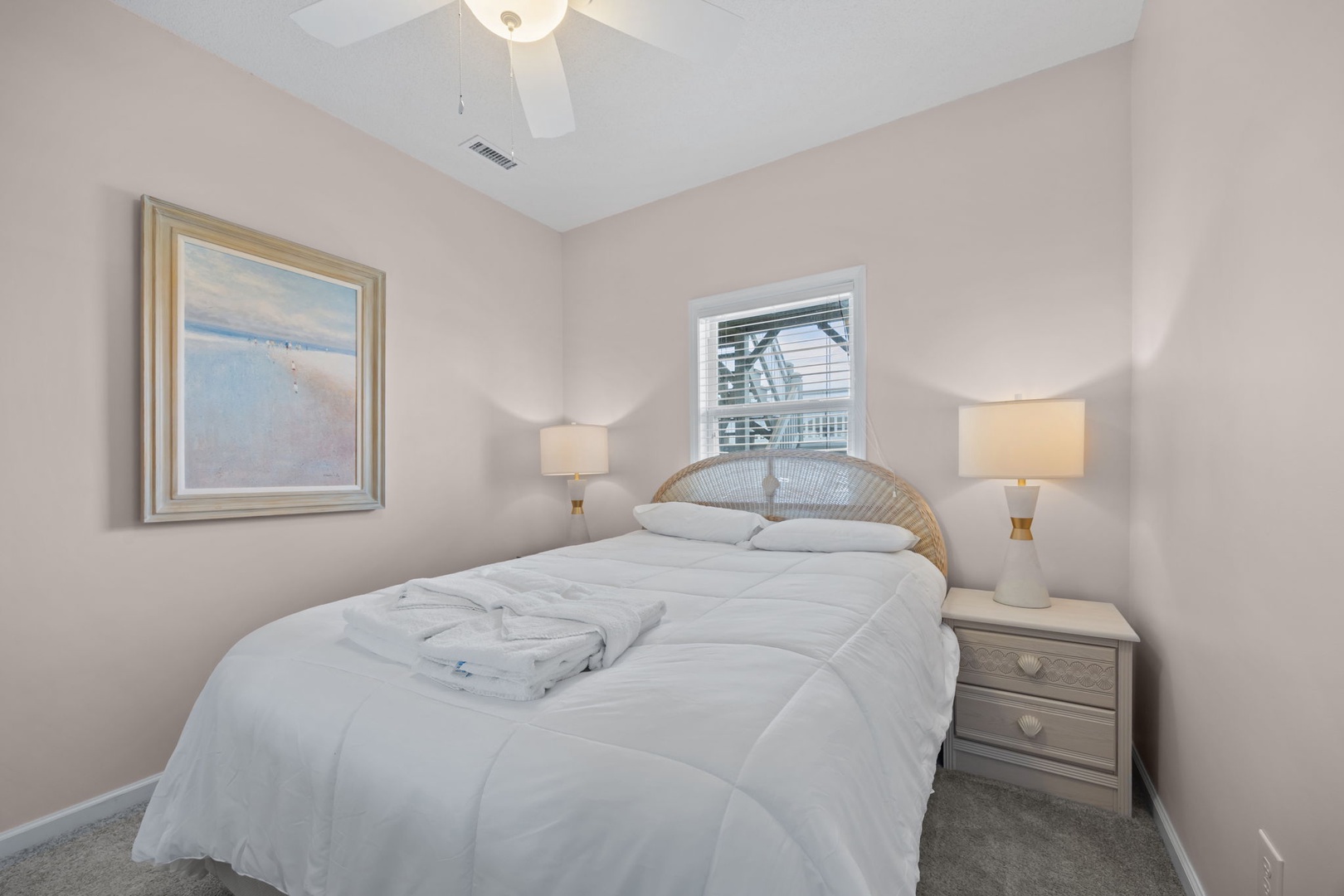 Drift into peaceful dreams in this cozy bedroom with soft linens, warm lighting, and thoughtful touches that make you feel right at home.