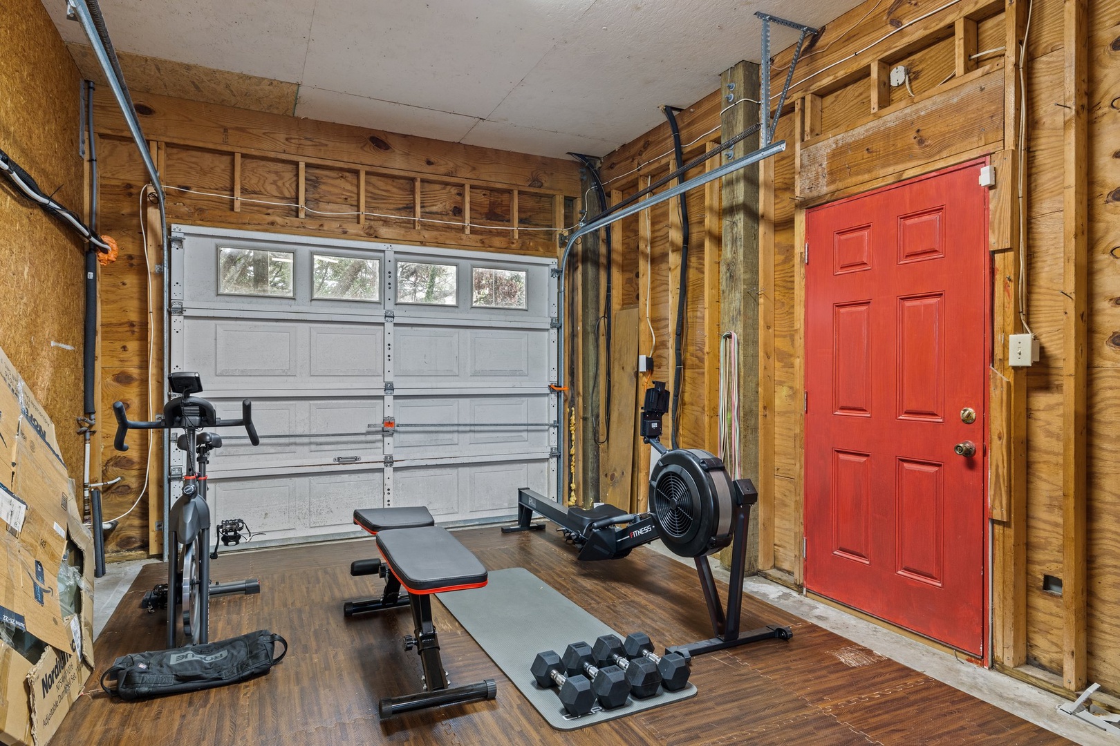 Your private garage gym awaits with professional equipment for energizing workouts during your mountain retreat.