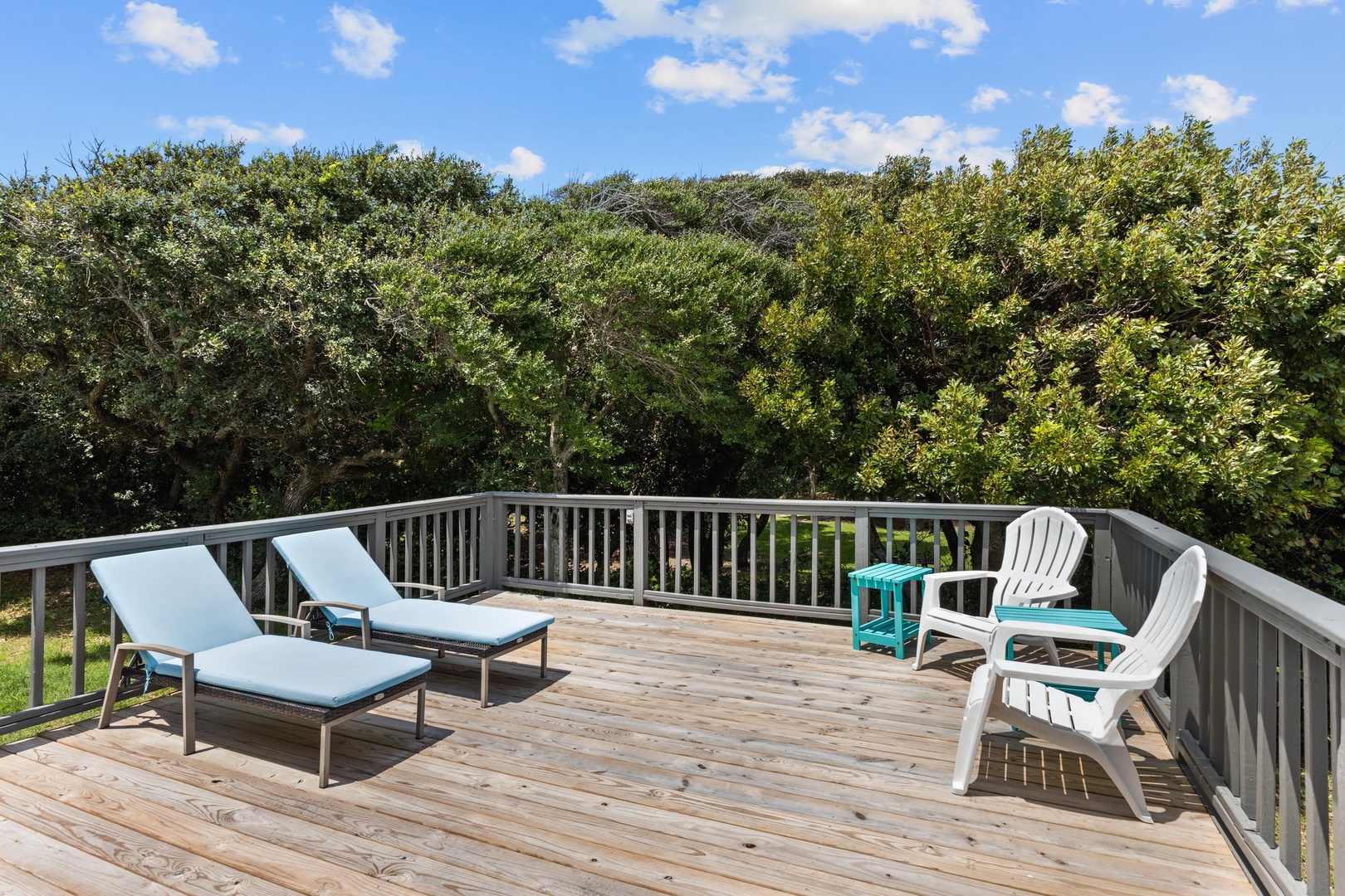 Unwind on your private deck with lounge chairs and peaceful forest views, perfect for morning coffee or afternoon relaxation.