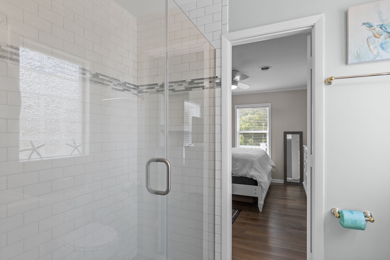 Step into your sparkling glass-enclosed shower with beautiful subway tiles, then relax in your cozy bedroom just steps away.