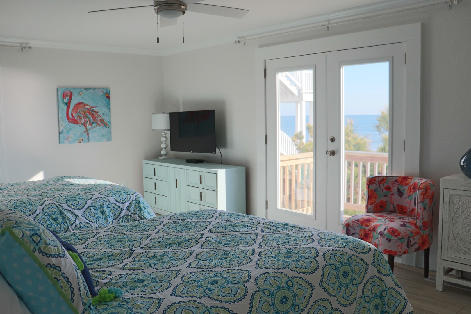 Drift off to sleep in your bright bedroom featuring twin beds and private balcony access to soak in stunning views.