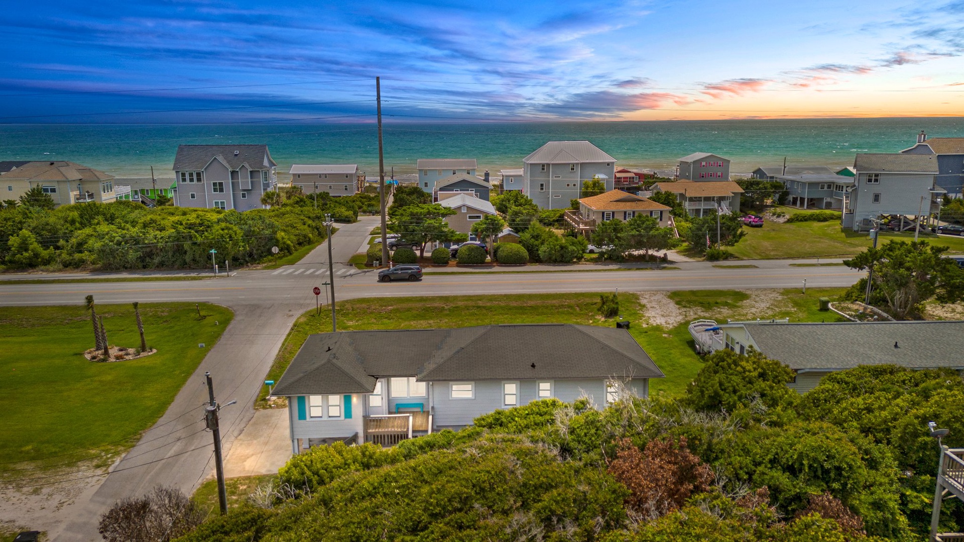 Coastal retreat nestled among beach houses with ocean views and easy beach access in a peaceful residential setting.