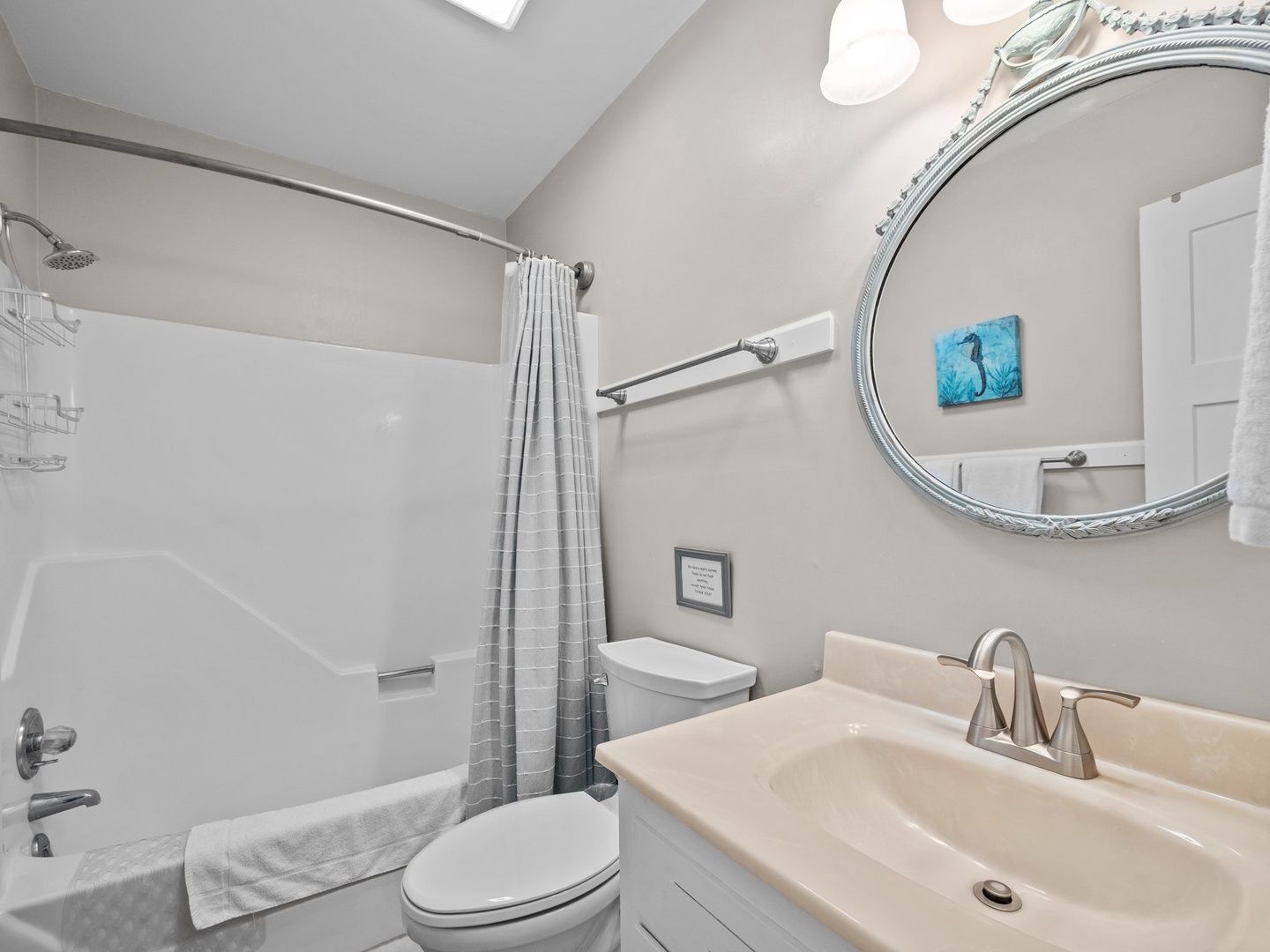 Refresh in your private bathroom with sleek fixtures, soft towels, and calming coastal artwork to start each day.